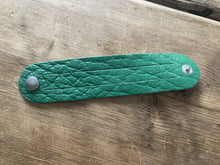 The WoggleMakers Scout Woggle Green / 5 Scouting Activity Packs - Unplaited Leather Woggles with instructions.